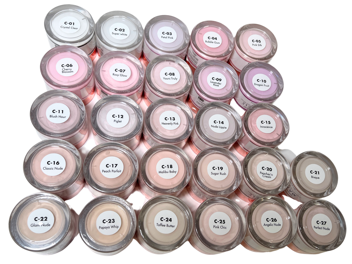 Multiple small containers of cosmetic product with visible labels on a white background