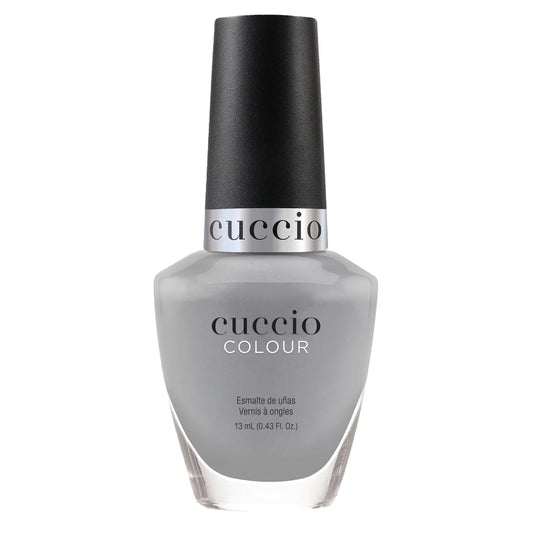 Cuccio nail polish bottle on a white background