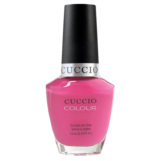 Cuccio nail polish bottle with pink color on a white background