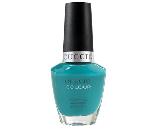 Teal nail polish bottle with black cap on a white background