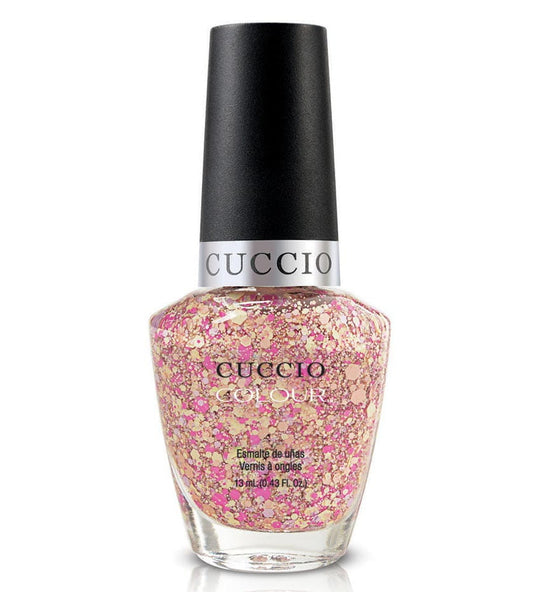 Cuccio nail polish bottle with pink glittery polish on a white background
