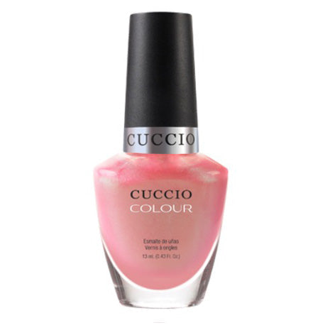 Cuccio nail polish bottle on a white background