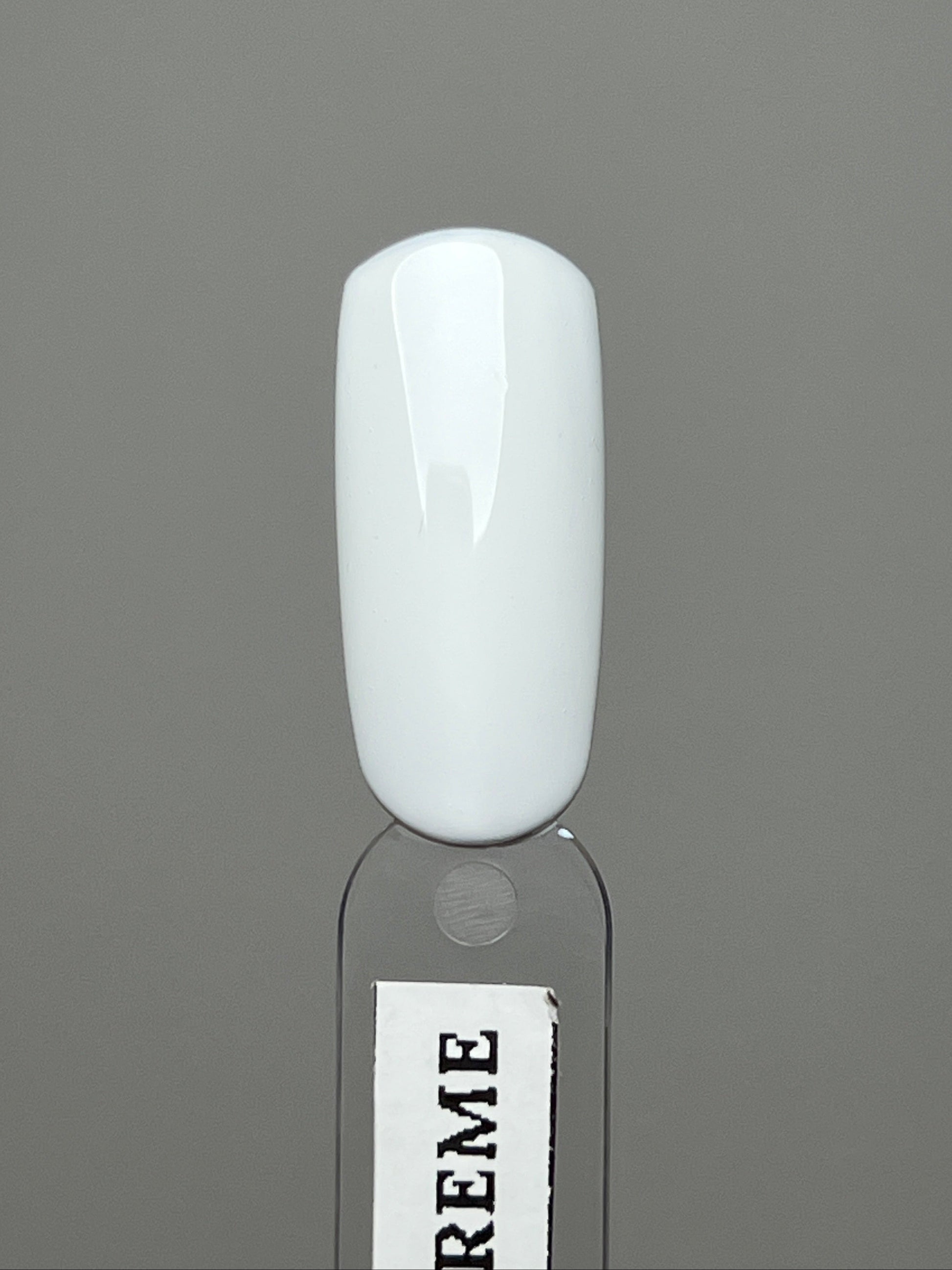 white nail polish swatch over a white background