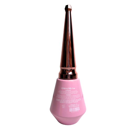 Pink nail product bottle with rose gold cap on a white background