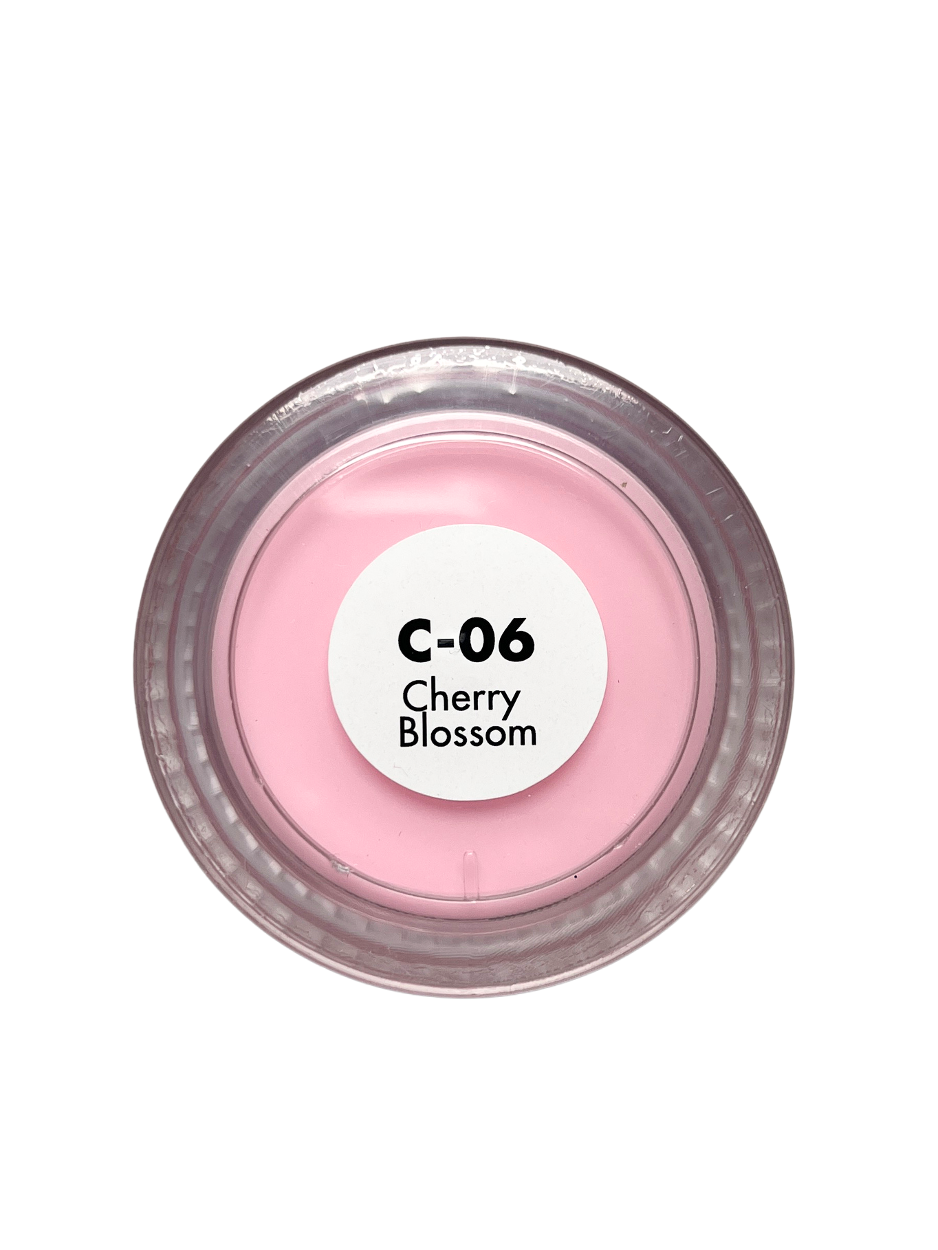 Pink cosmetic compact labeled 'Cherry Blossom' on a white background