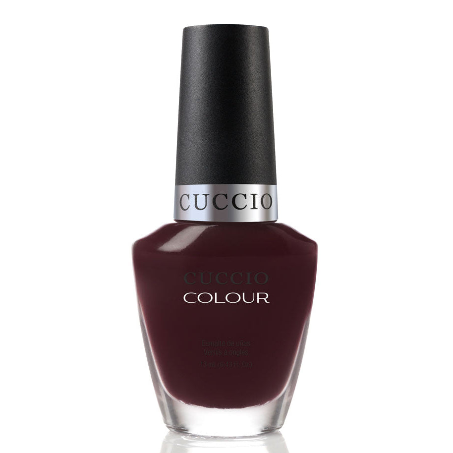 Guccio nail polish bottle with dark red color on a white background