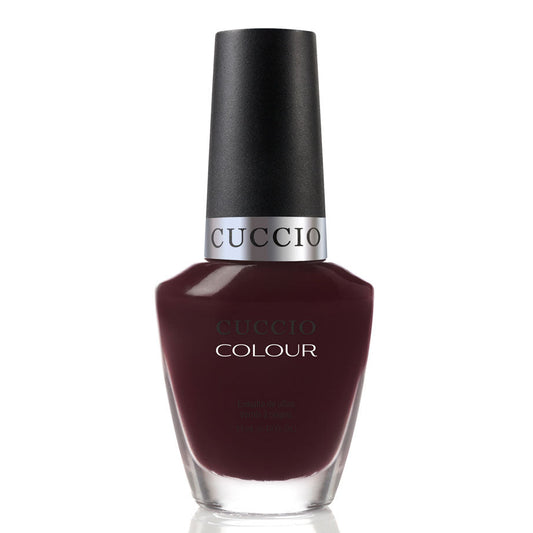 Guccio nail polish bottle with dark red color on a white background