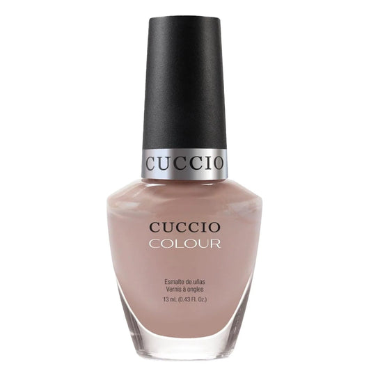 Cuccio nail polish bottle on a white background