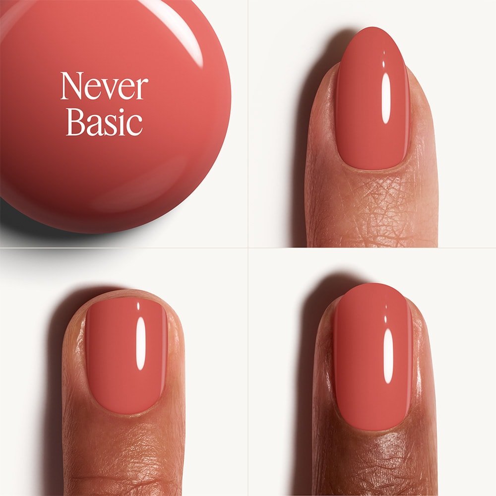 Nail polish color swatch with 'Never Basic' text and nail application on a white background