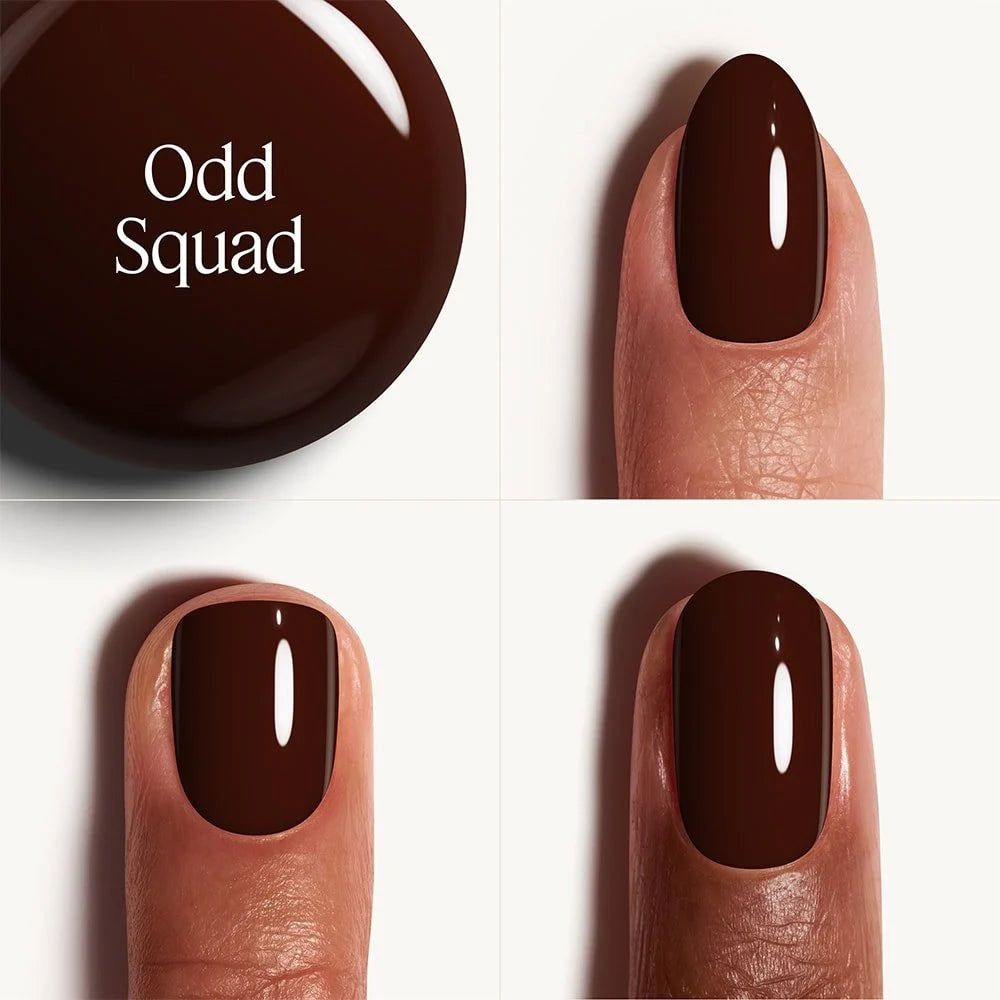 Brown nail polish with 'Odd Squad' branding on a white background