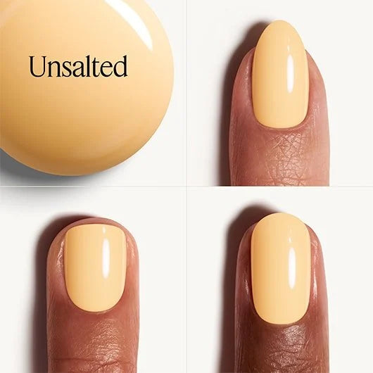 Nail polish in a yellow color with 'Unsalted' branding on a white background.