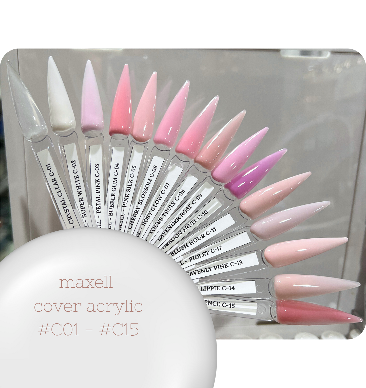 Maxell cover acrylic nail tips with pink and white designs on a clear background