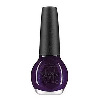 purple glitter nail polish with a black cap over a white background