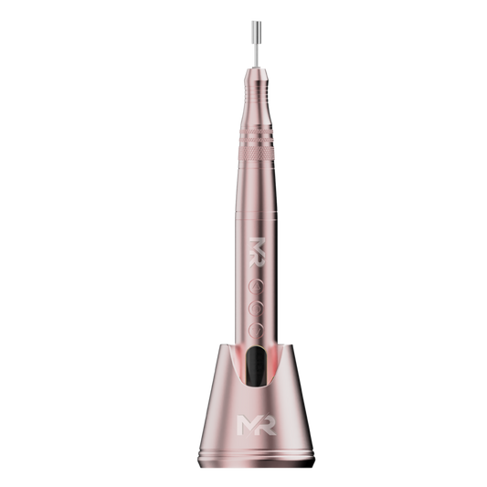 pink colored nail drill on a pink colored charging stand on a white background