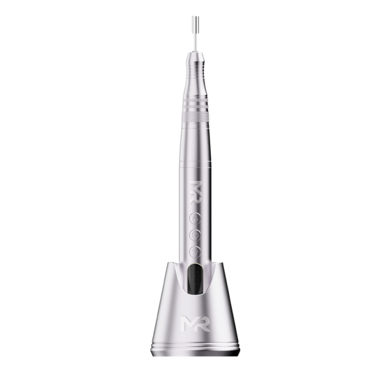 silver portable nail drill on a silver charging stand on a white background