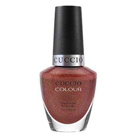 Cuccio nail polish bottle with a metallic red color on a white background