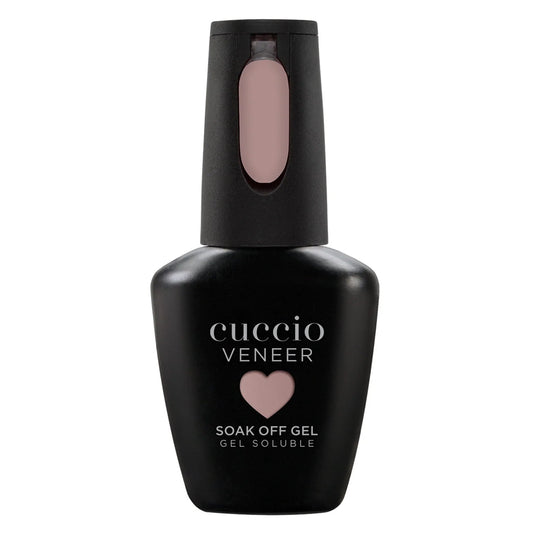 Cuccio Veneer soak off gel bottle with a pink cap on a white background